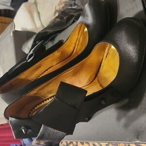 Black Satin pumps with stud and bow detail.